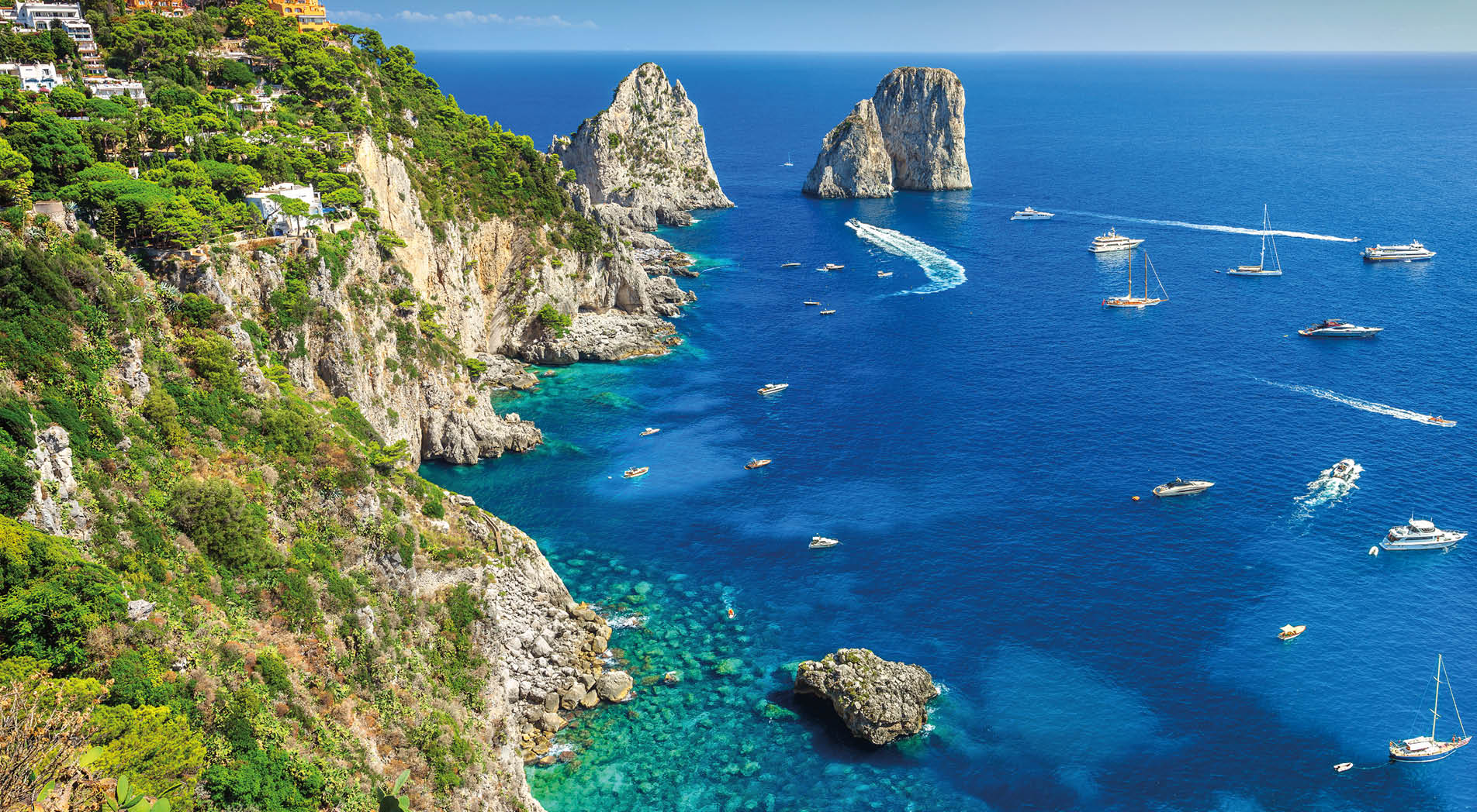 Amazing Faraglioni cliffs panorama with the majestic Tyrrhenian sea in background, Capri island, Campania region, Italy, Europe