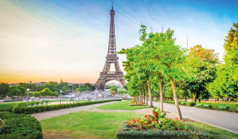 Paris Eiffel Tower and Trocadero garden at sunrise in Paris, France. Web banner format. Eiffel Tower is one of the most iconic landmarks of Paris at early morning