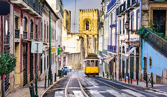 Lisbon, Porgugal cityscape and tram near Lisbon Cathedral.