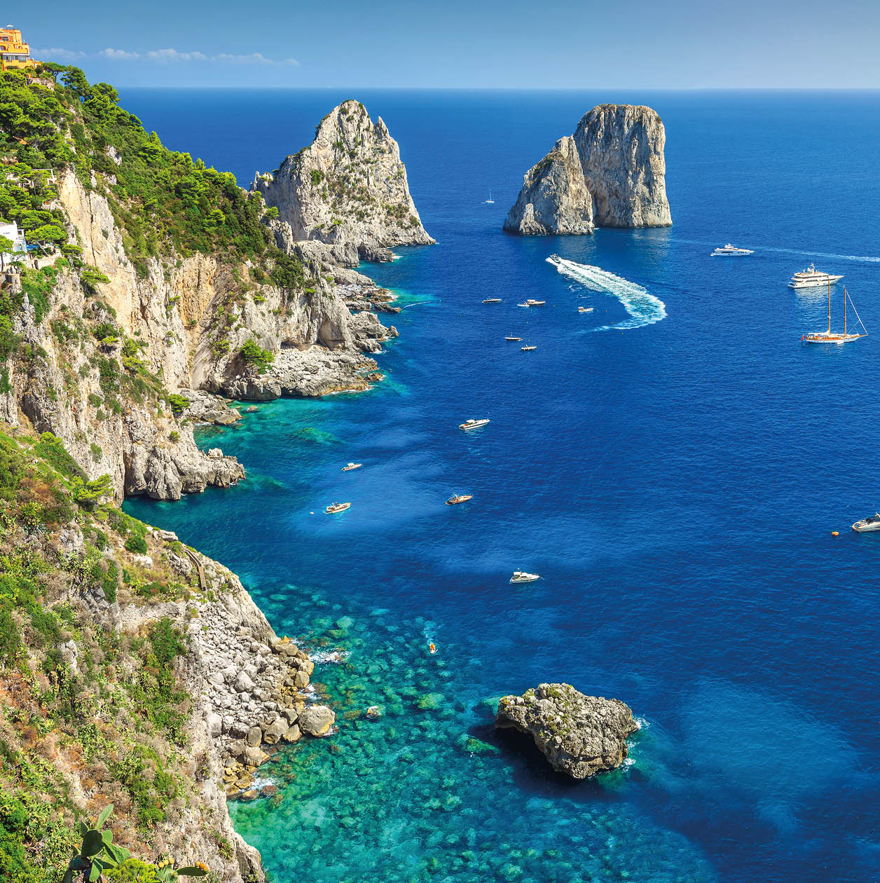 Amazing Faraglioni cliffs panorama with the majestic Tyrrhenian sea in background, Capri island, Campania region, Italy, Europe