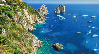 Amazing Faraglioni cliffs panorama with the majestic Tyrrhenian sea in background, Capri island, Campania region, Italy, Europe