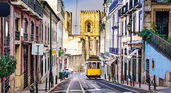 Lisbon, Porgugal cityscape and tram near Lisbon Cathedral.