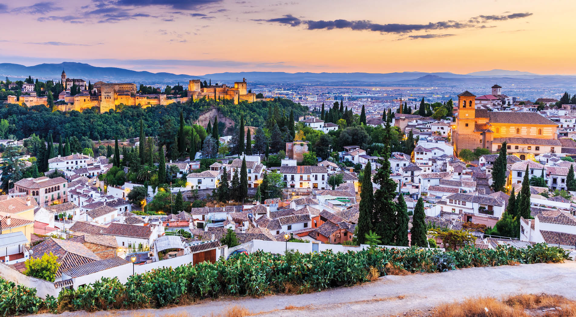 Alhambra of Granada, Spain. Alhambra fortress and Albaicin quarter at twilight.