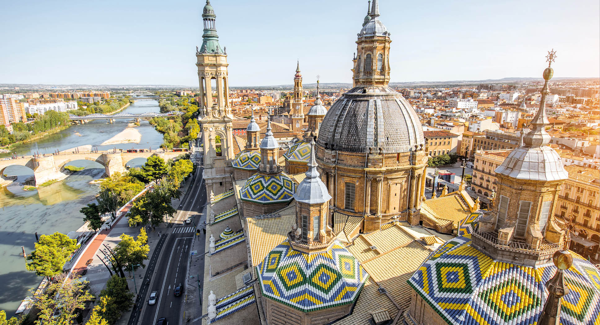 Aerial cityscape view on the roofs and spires of basilica of Our Lady in Zaragoza city in Spain