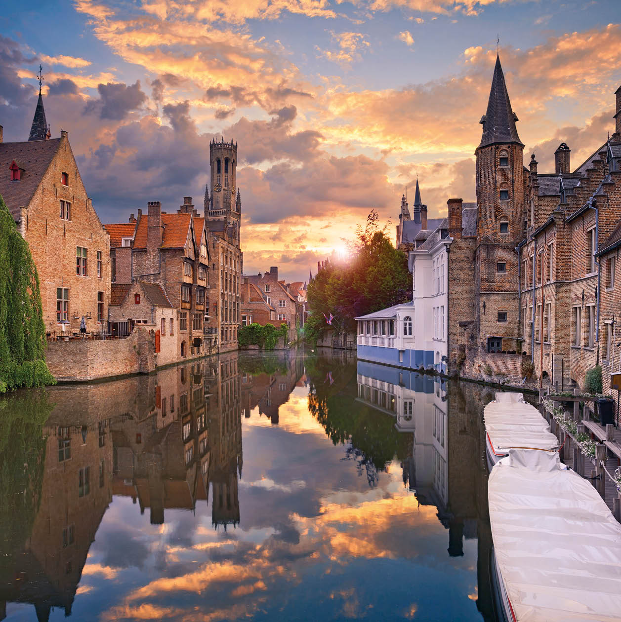 Image of famous most photographed location in Bruges, Belgium during dramatic sunset.