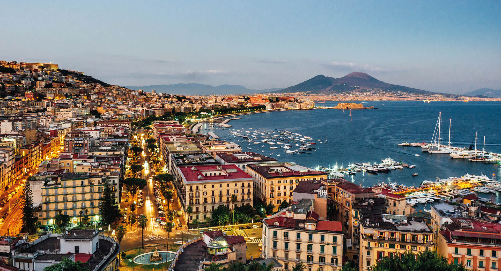 Naples at sunset - Gulf of Naples, Italy. View of the city from elevated point of view.