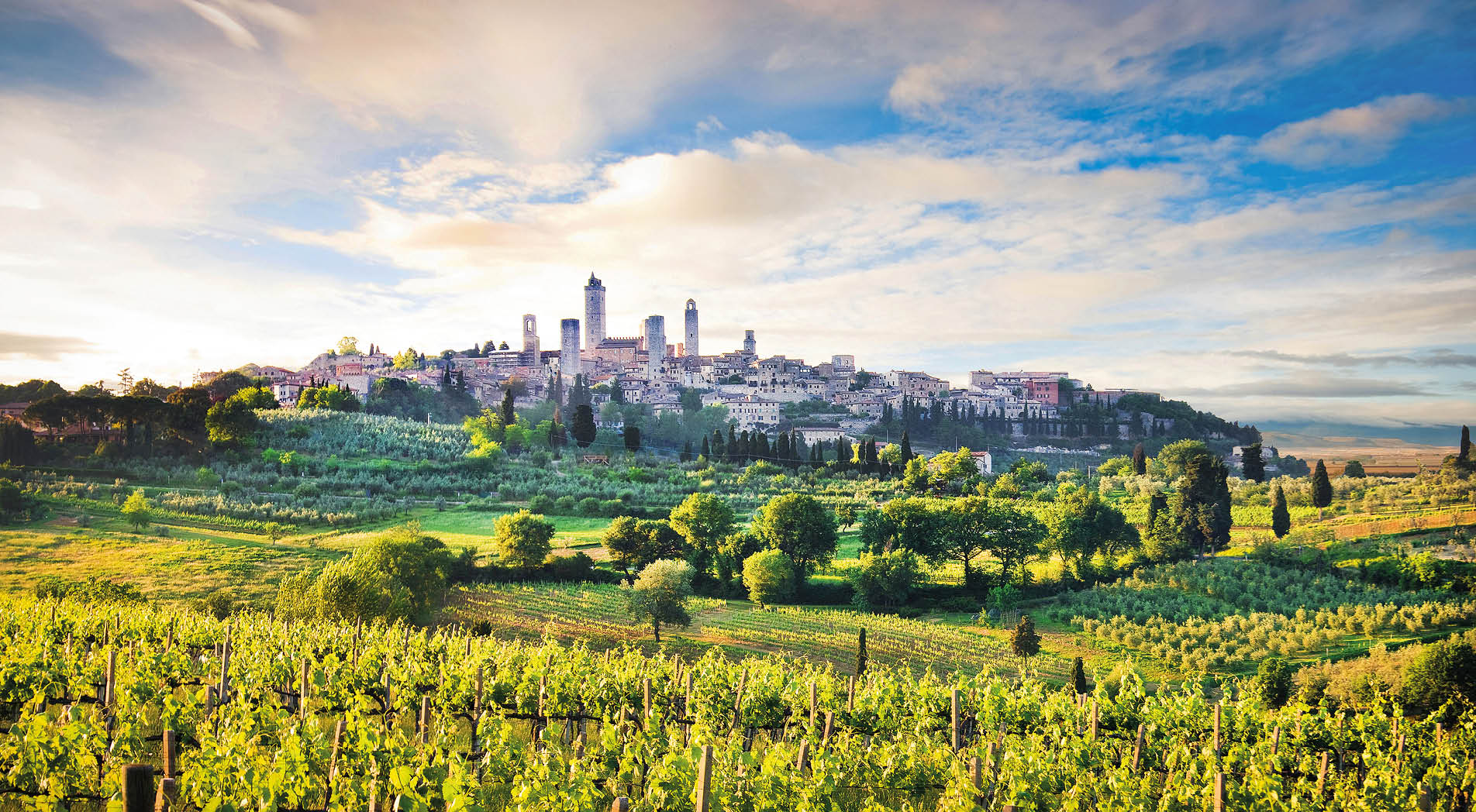 Beautiful landscape with the medieval city of San Gimignano at sunset in Tuscany, province of Siena, Italy.