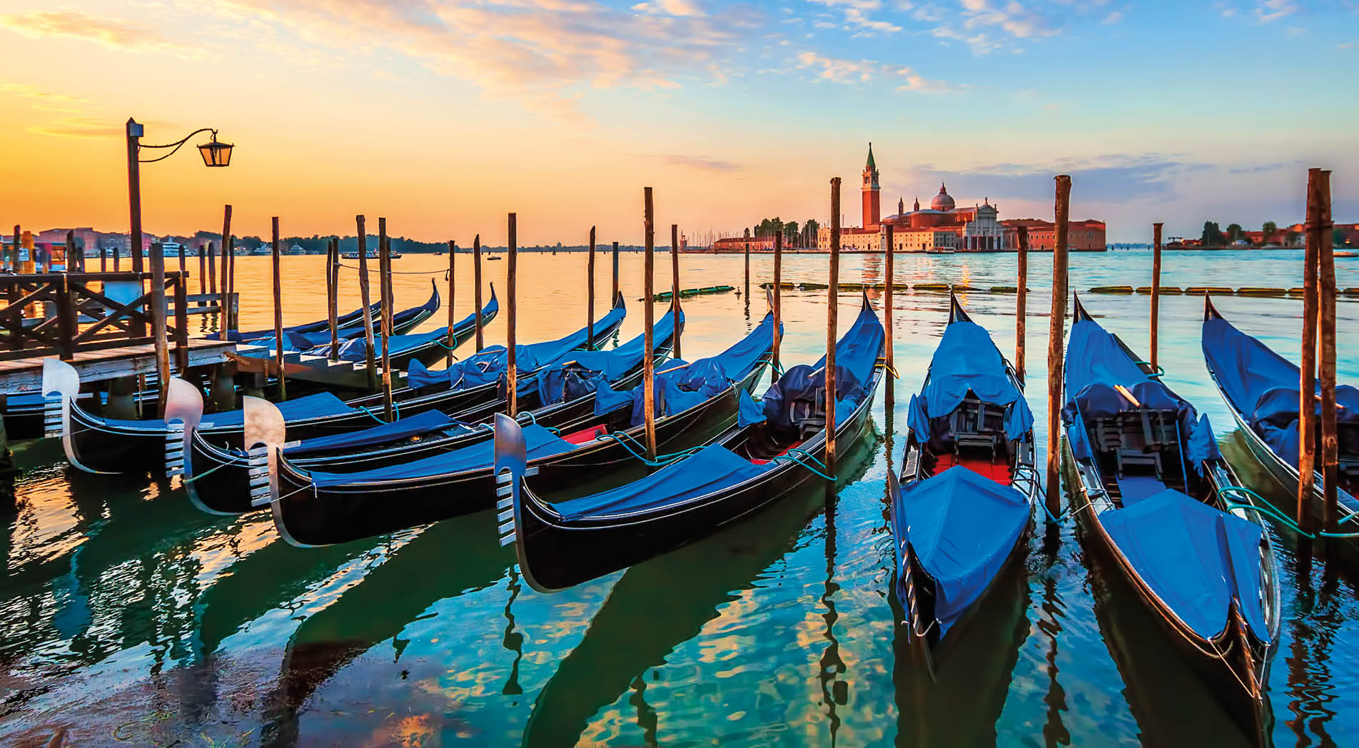 Venice with famous gondolas at sunrise, Italy