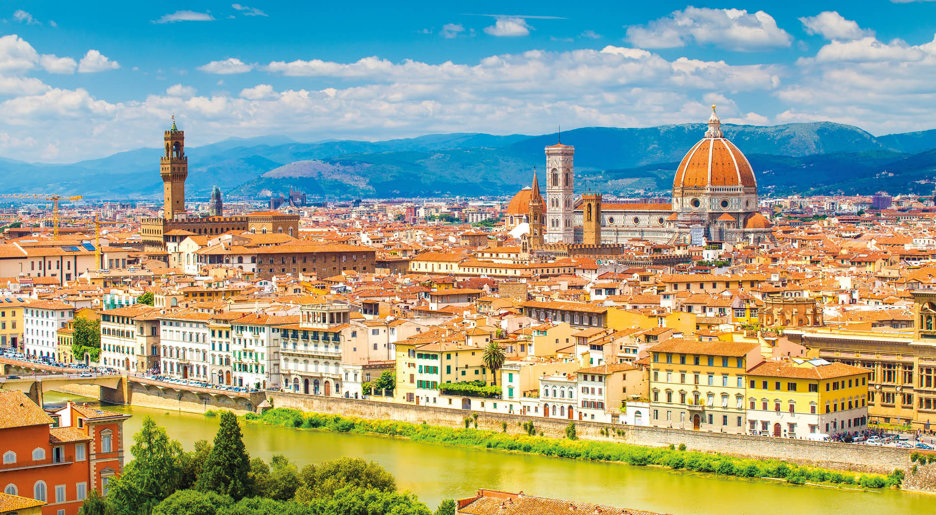 Florence in summer. Stunning Florence cityscape with Arno river and clear blue sky. Historic center of Florence.