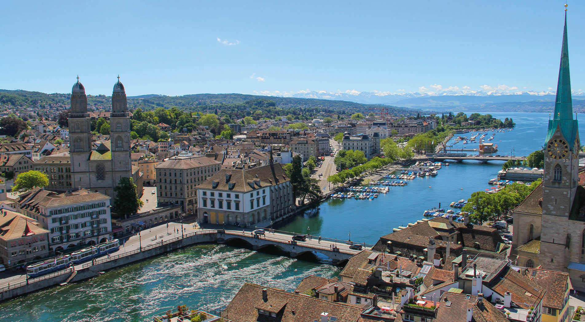 A view of the city centre of Zurich and the surrounding mountains. 