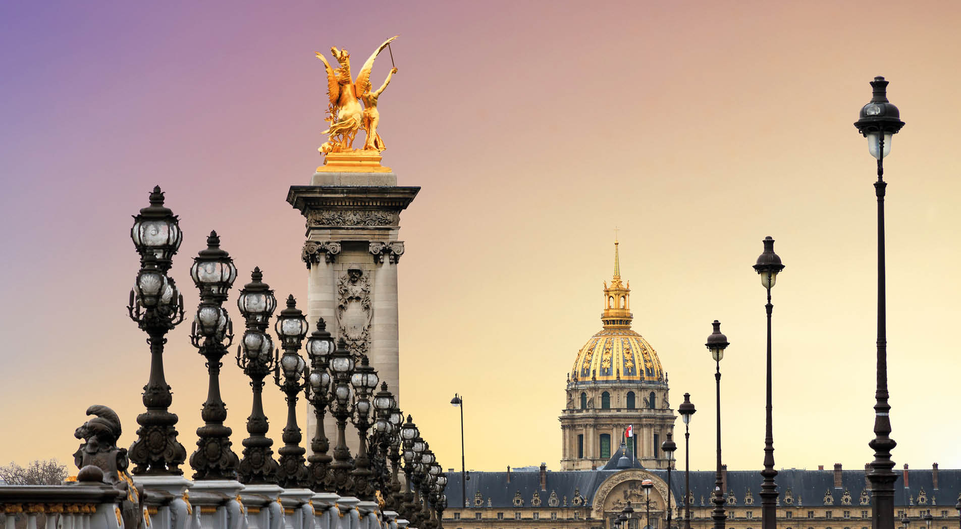 Beautiful sunrise at the Pont Alexandre III and Les Invalides in Paris