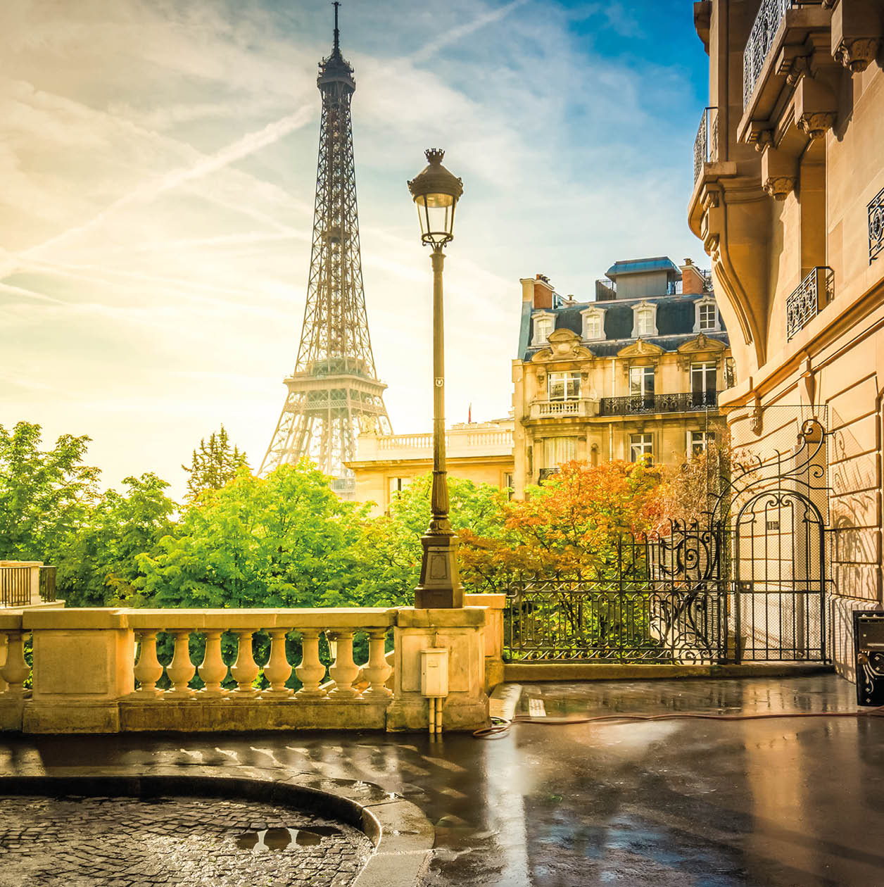 cosy Paris street with view on the famous Eiffel Tower on a cloudy summer day, Paris France, retro toned