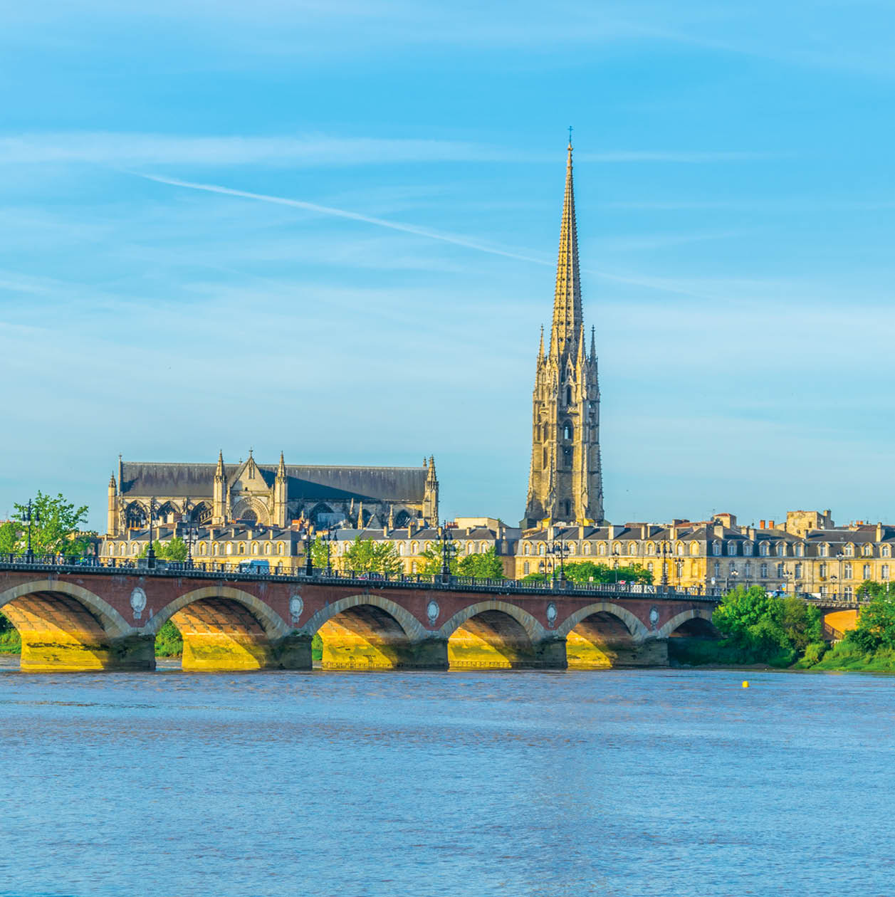 Pont de Pierre and basilica of Saint Michel in Bordeaux, France