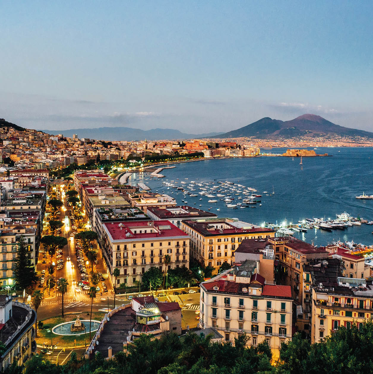 Naples at sunset - Gulf of Naples, Italy. View of the city from elevated point of view.