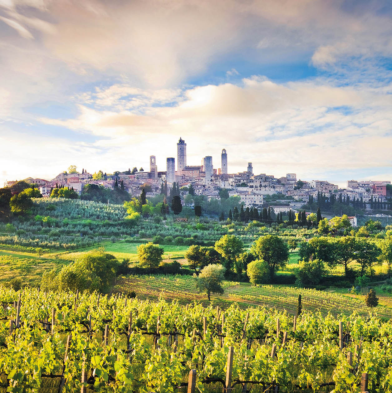 Beautiful landscape with the medieval city of San Gimignano at sunset in Tuscany, province of Siena, Italy.