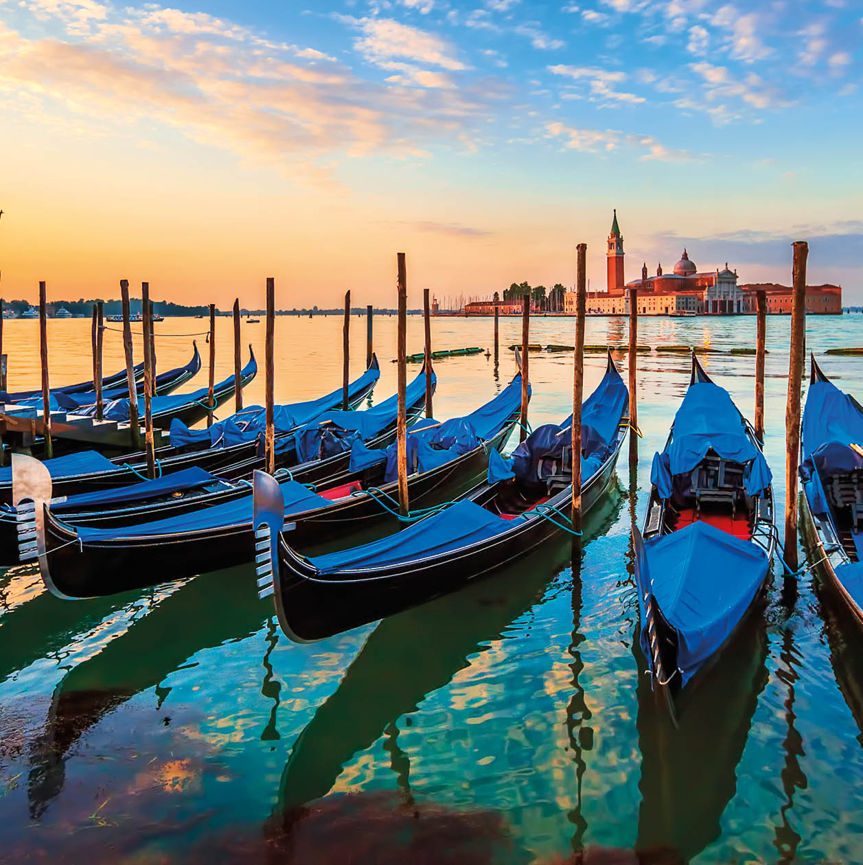 Venice with famous gondolas at sunrise, Italy