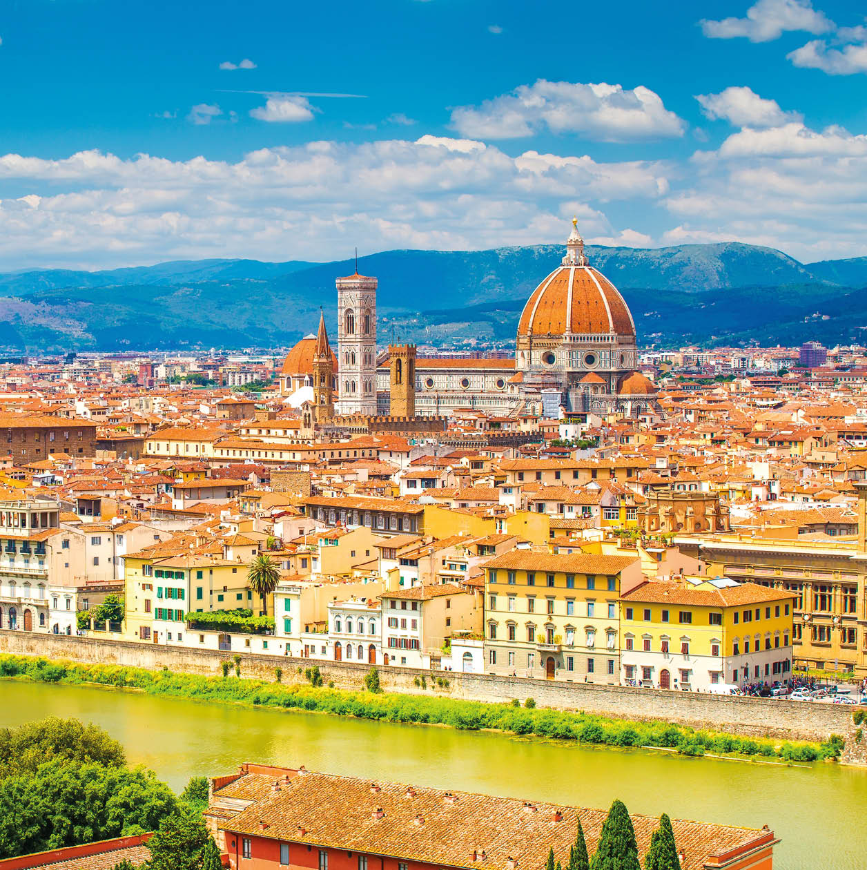 Florence in summer. Stunning Florence cityscape with Arno river and clear blue sky. Historic center of Florence.