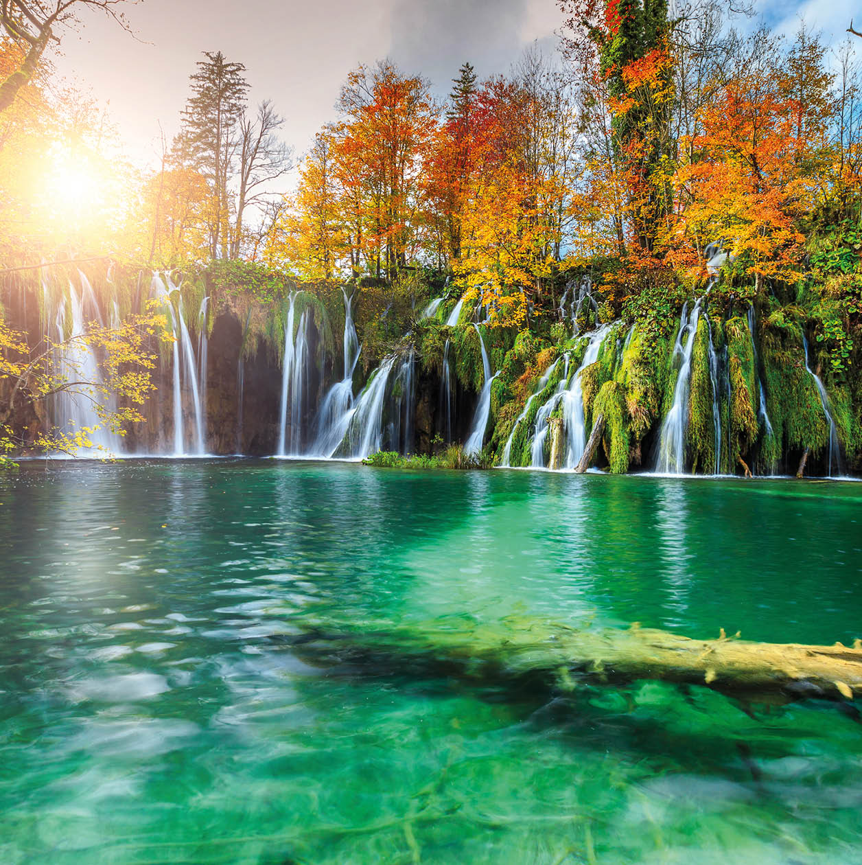 Stunning colorful autumn landscape with spectacular lake and waterfalls in Plitvice lakes National Park, Croatia, Europe