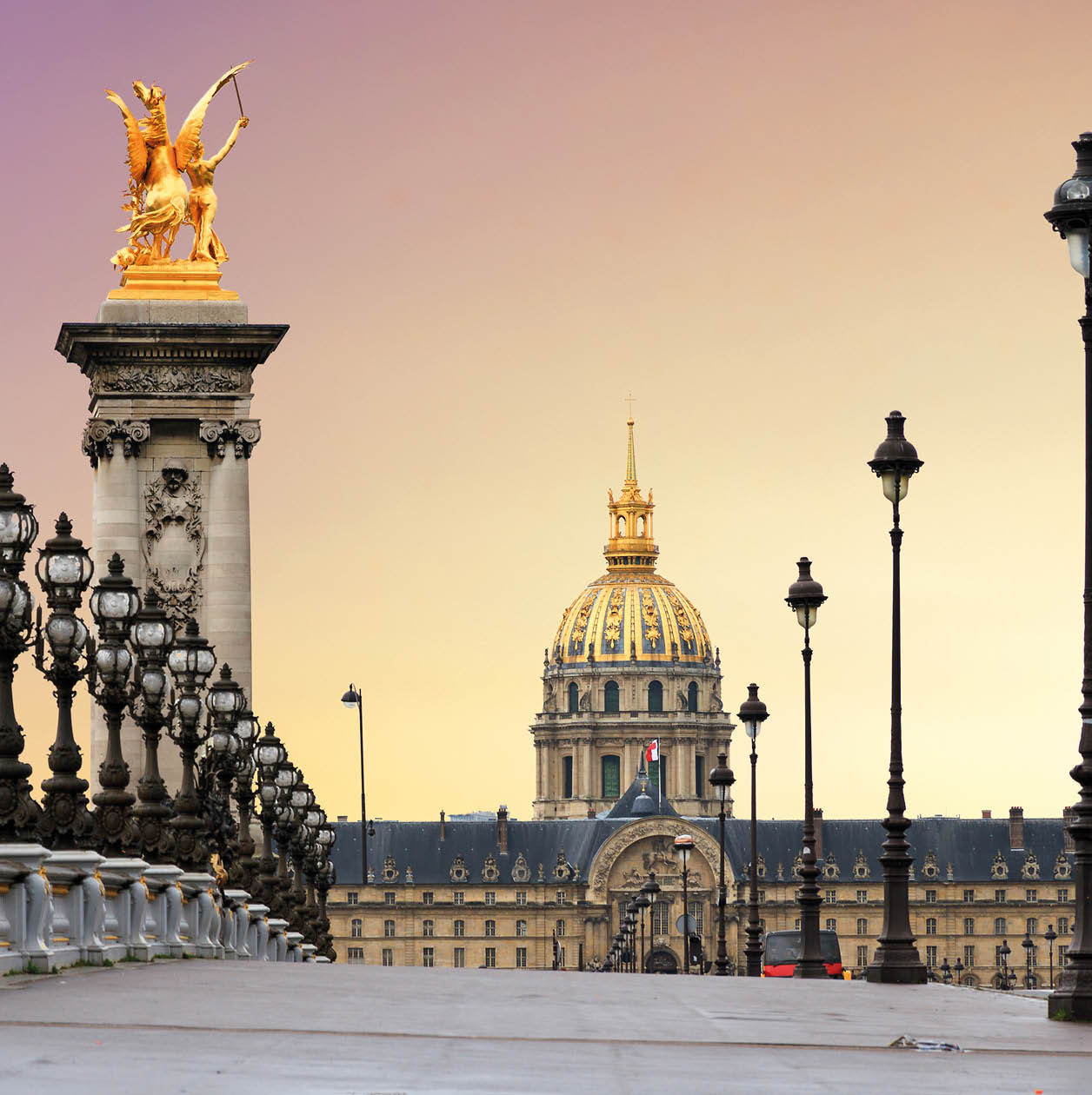 Beautiful sunrise at the Pont Alexandre III and Les Invalides in Paris