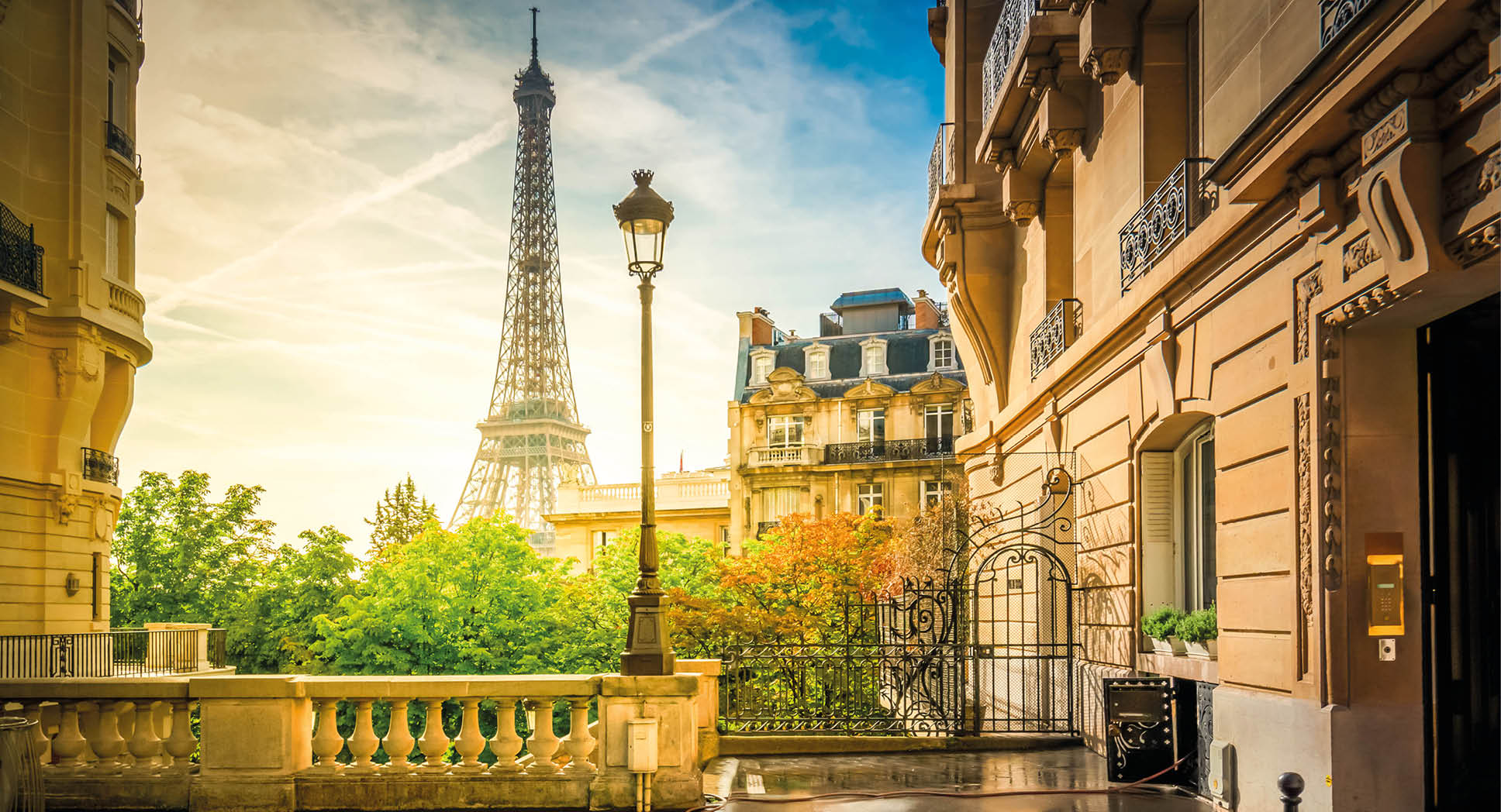 cosy Paris street with view on the famous Eiffel Tower on a cloudy summer day, Paris France, retro toned