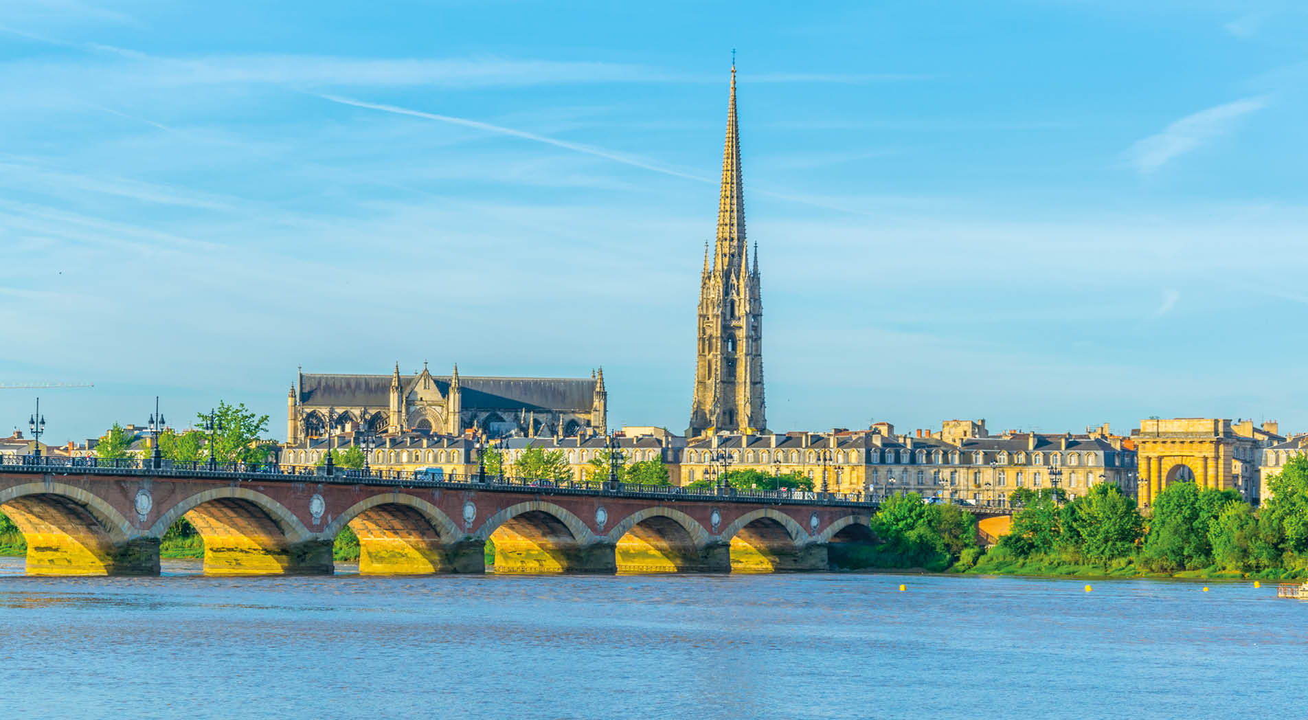 Pont de Pierre and basilica of Saint Michel in Bordeaux, France