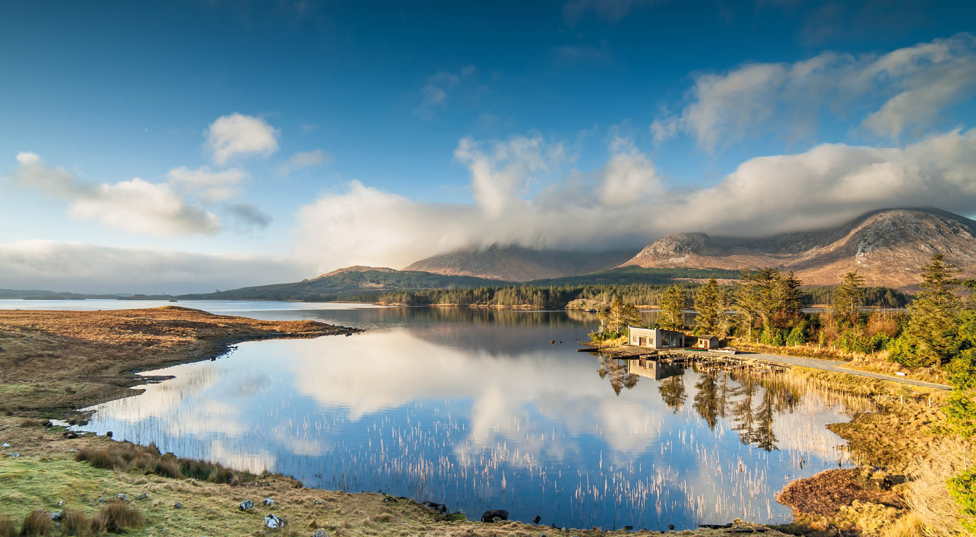 Winter Sunrise over a still lake in Connemara, in the West of Ireland. 