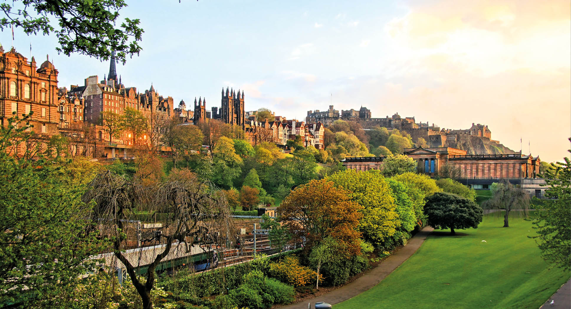 View of old Edinburgh, Scotland at sunset from Princes Street Gardens