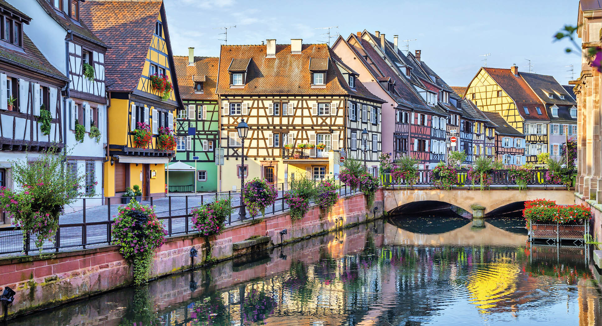 Colorful traditional french houses on the side of river Lauch in Petite Venise, Colmar, France