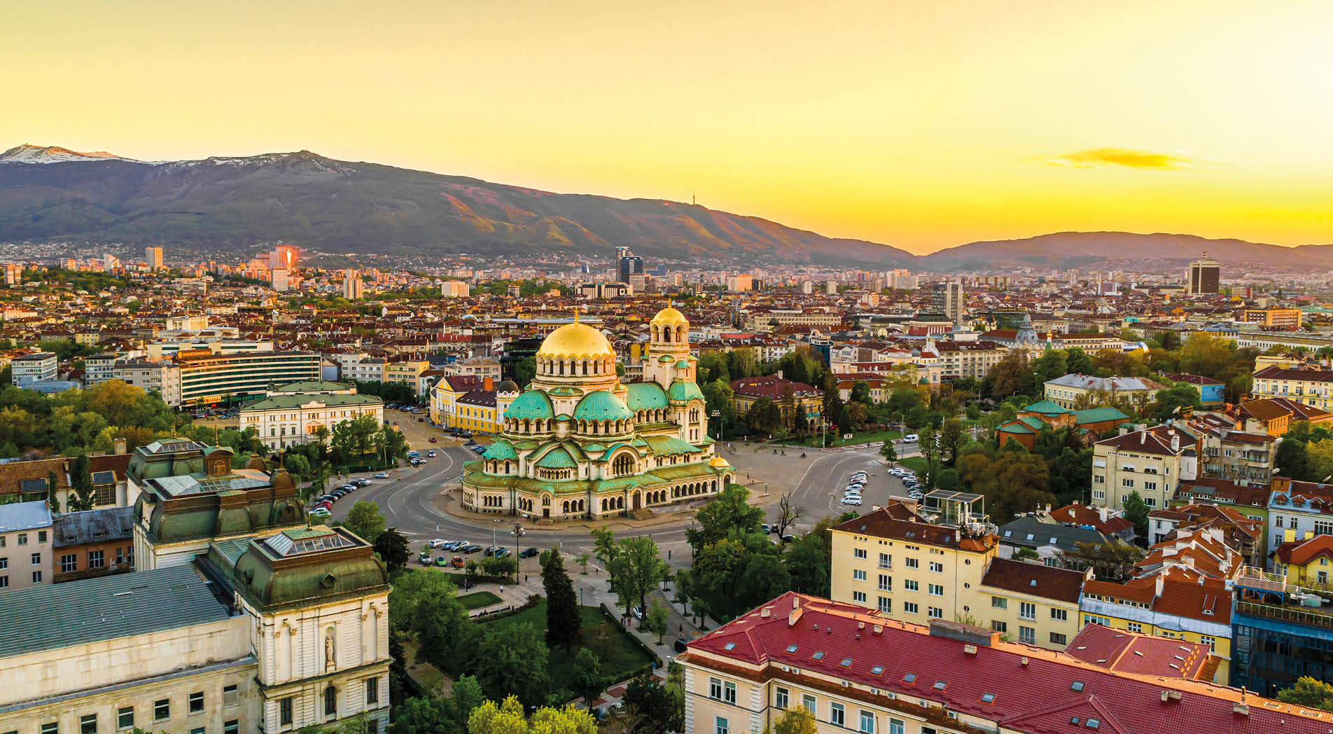 Beautiful drone shot of downtown district of Sofia, Bulgaria, St. Alexader Nevski Cathedral in the middle, gold colored domes. (Bulgarian: Красив кадър от дрон на централната част на София, България, храм-паметник Свети Александър Невски в средата, златни куполи/кубета). The photo is taken with drone DJI Phantom 4 Pro.