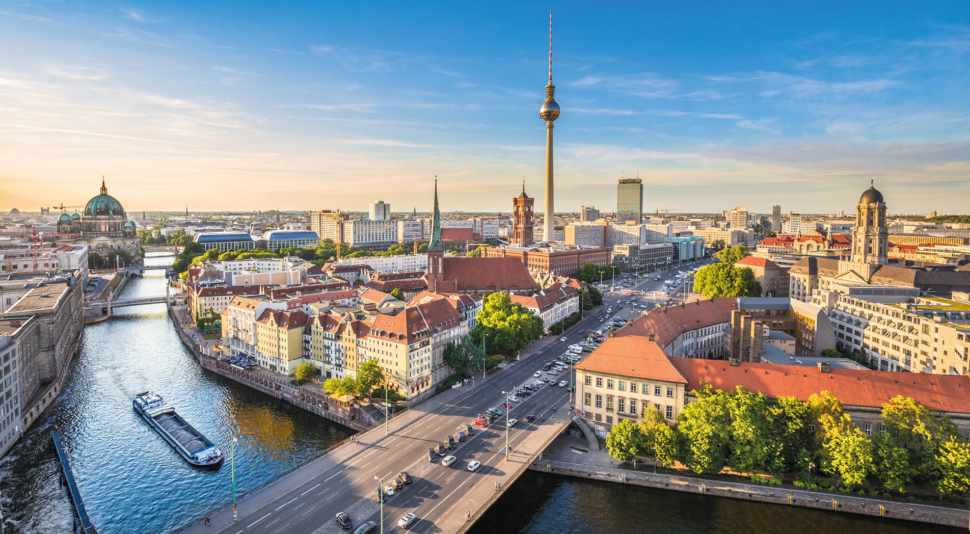 Aerial view of Berlin skyline with famous TV tower and Spree river in beautiful evening light at sunset, Germany