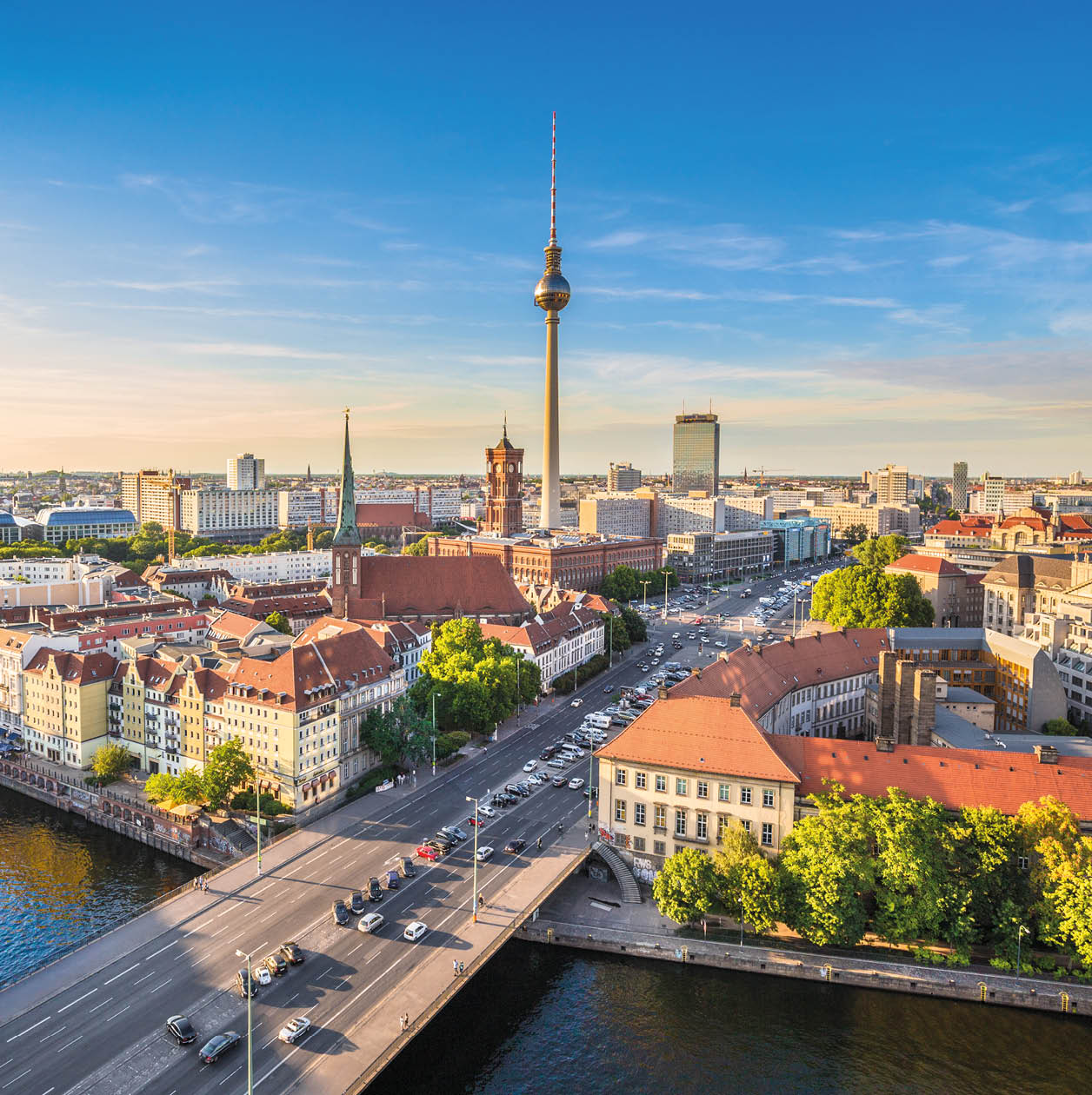Aerial view of Berlin skyline with famous TV tower and Spree river in beautiful evening light at sunset, Germany
