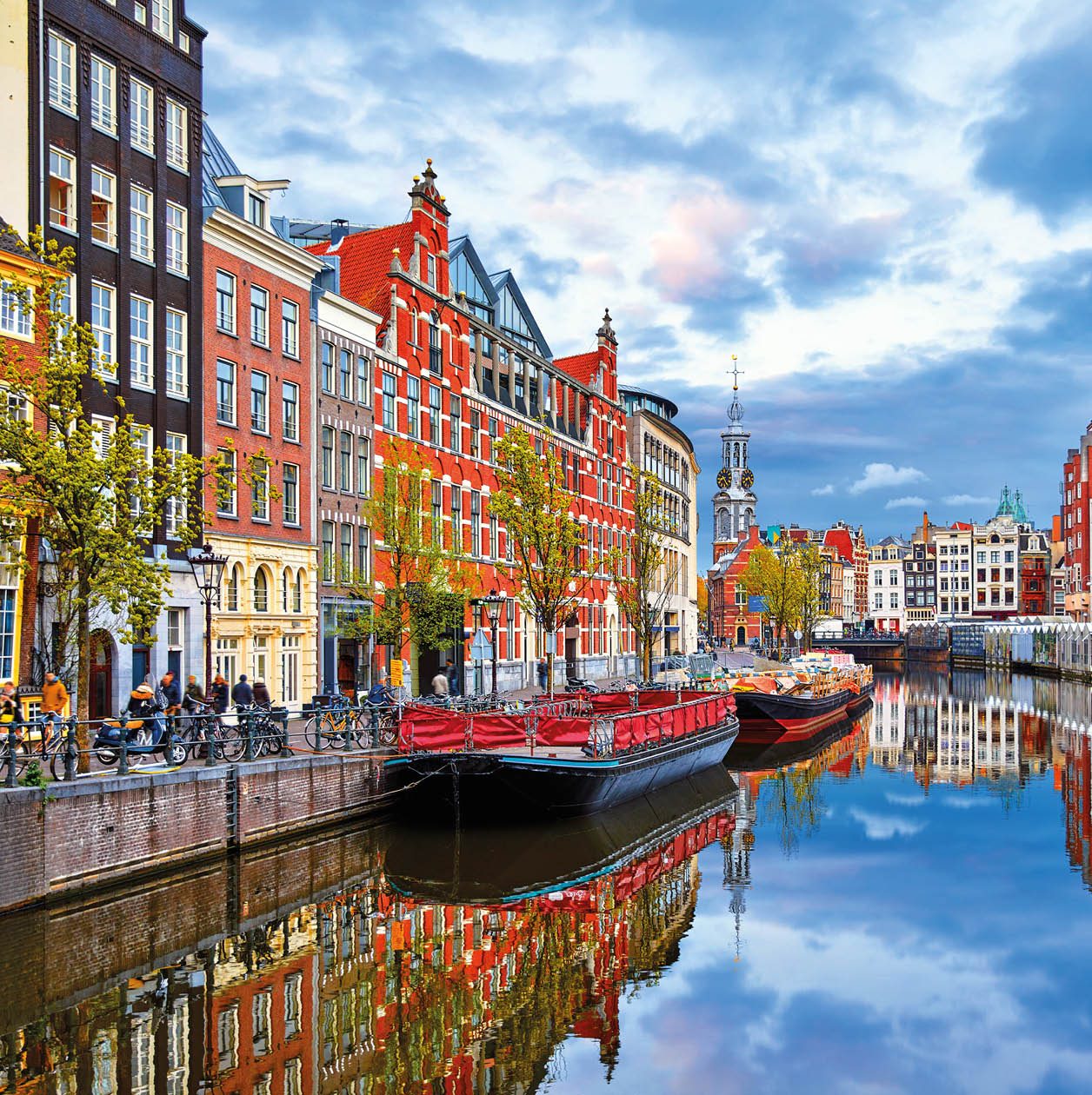 Channel in Amsterdam Netherlands houses river Amstel landmark old european city spring landscape.