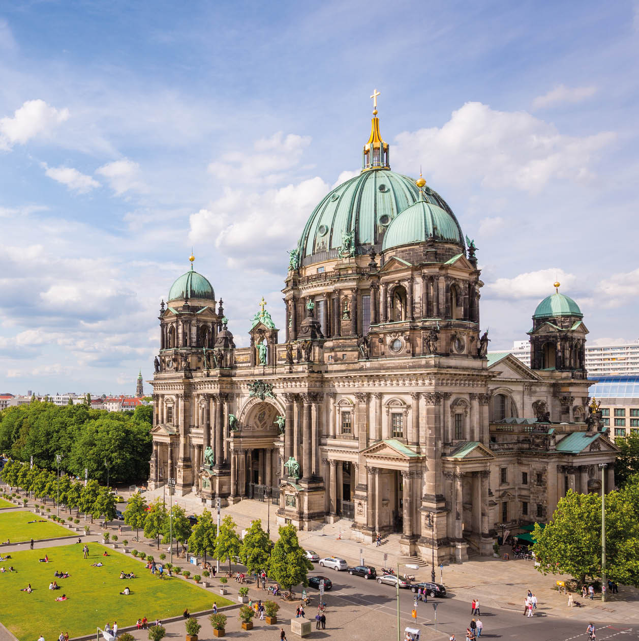 Aerial view down to with tourists and visitors crowded Lustgarten Park next to the famous Berliner Dom in Downtown Berlin, Germany.