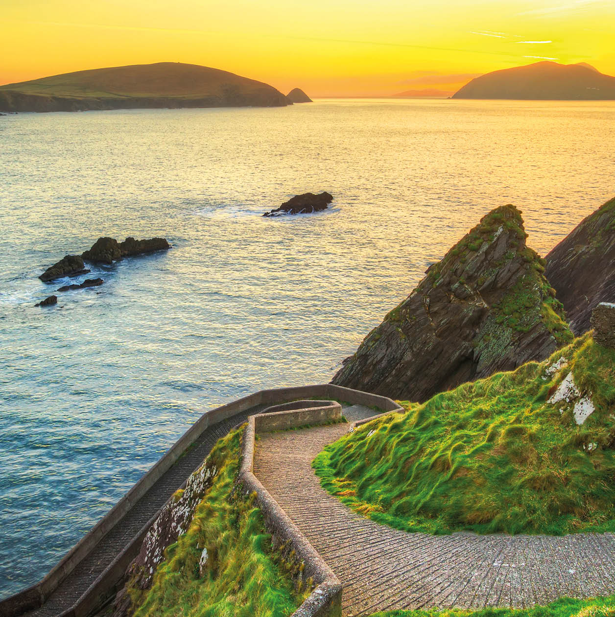 Sunset over pathway leading to Dunquin Pier on Dingle Peninsula, Co.Kerry, Ireland - HDR