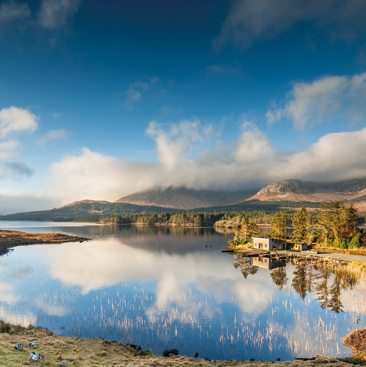 Winter Sunrise over a still lake in Connemara, in the West of Ireland. 