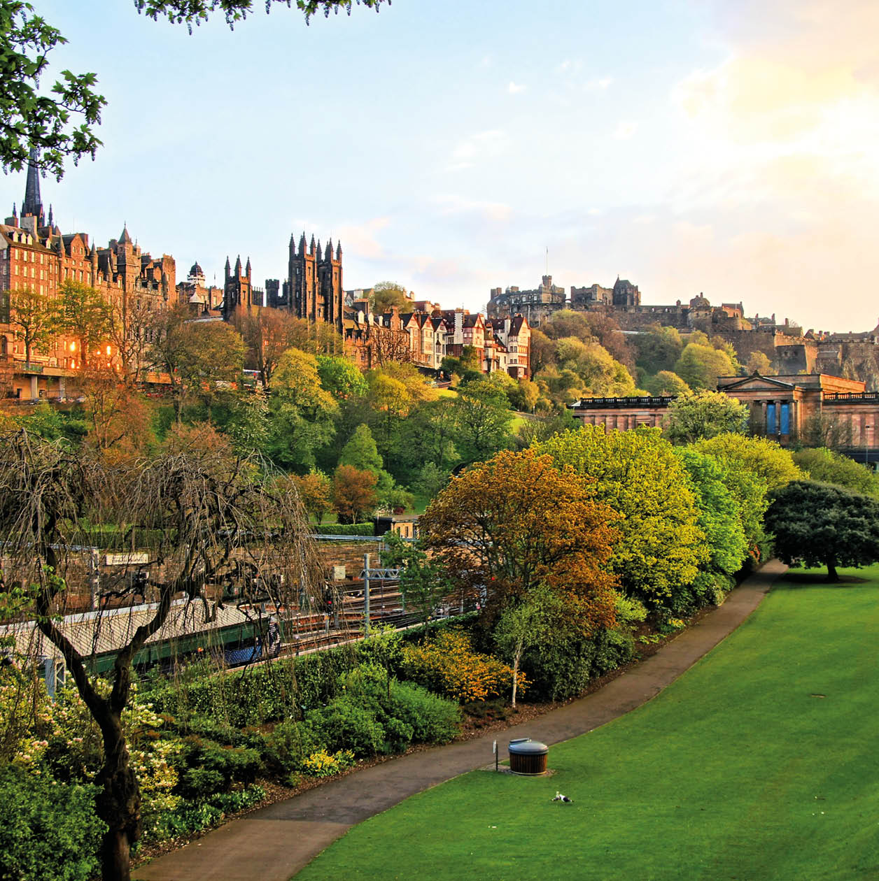 View of old Edinburgh, Scotland at sunset from Princes Street Gardens