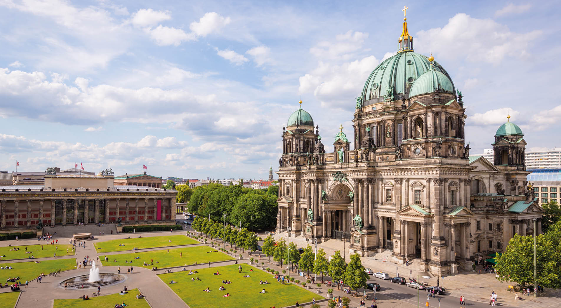 Aerial view down to with tourists and visitors crowded Lustgarten Park next to the famous Berliner Dom in Downtown Berlin, Germany.