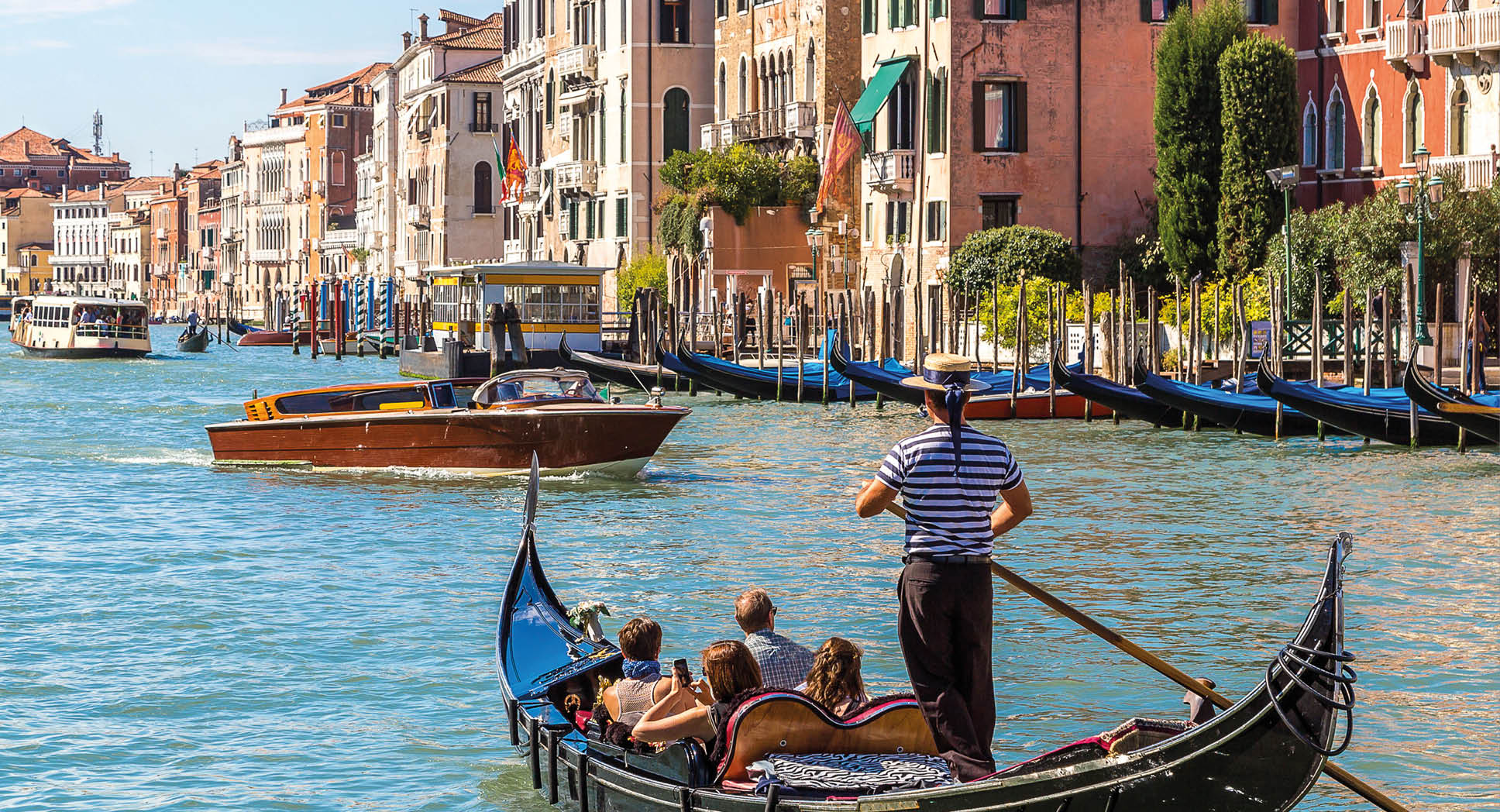 Gondola on Canal Grande in Venice, in a beautiful summer day in Italy