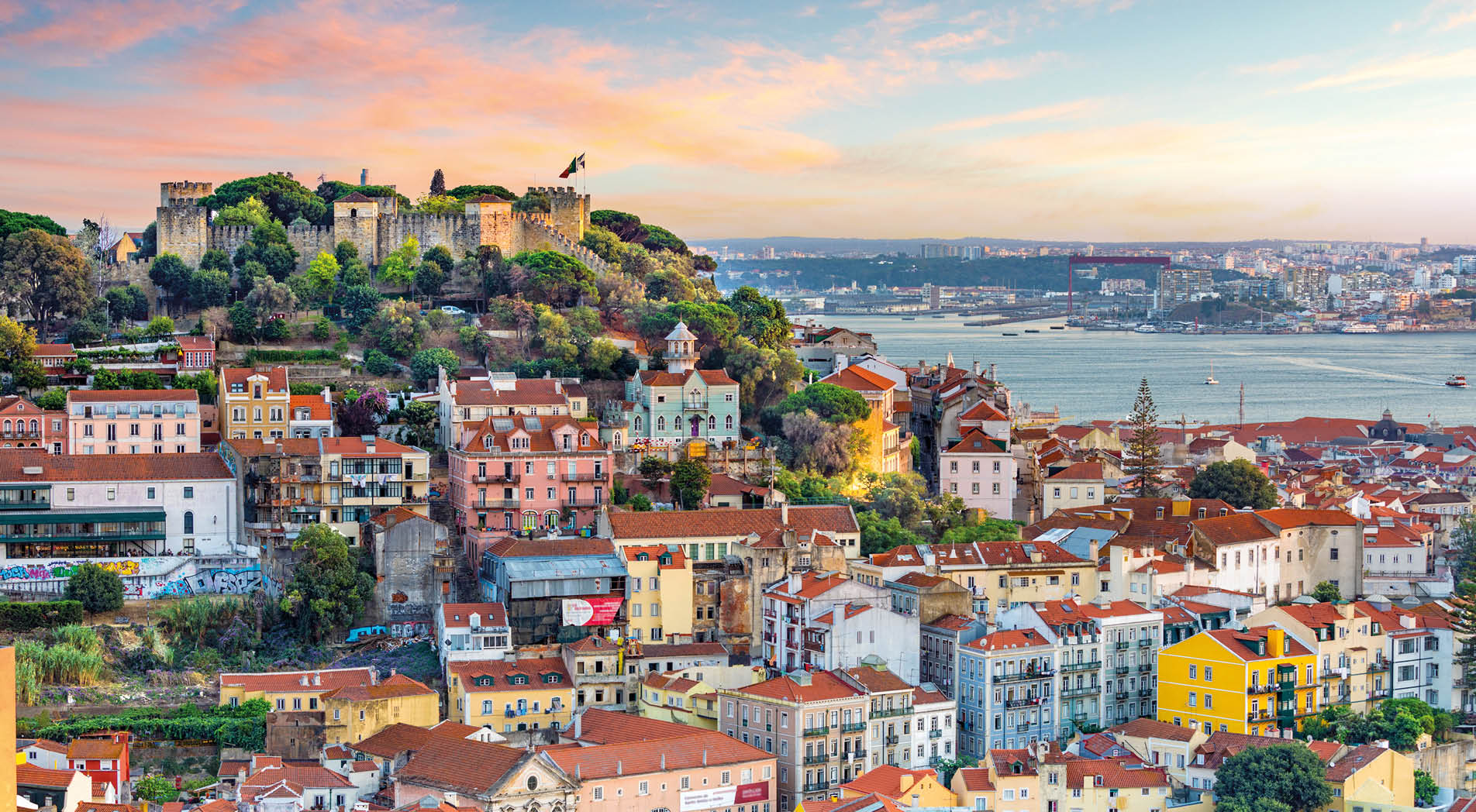 Lisbon, Portugal skyline at Sao Jorge Castle at sunset.