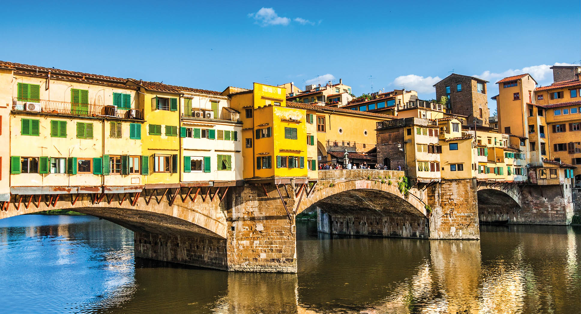 Famous Ponte Vecchio with river Arno at sunset in Florence, Italy