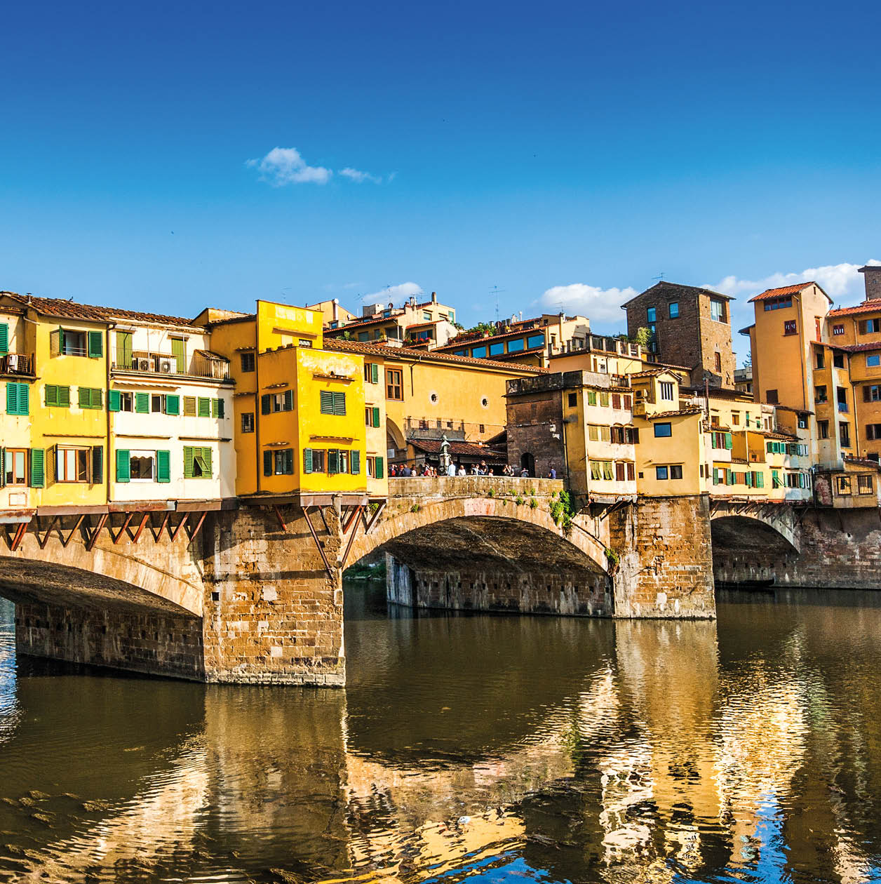 Famous Ponte Vecchio with river Arno at sunset in Florence, Italy