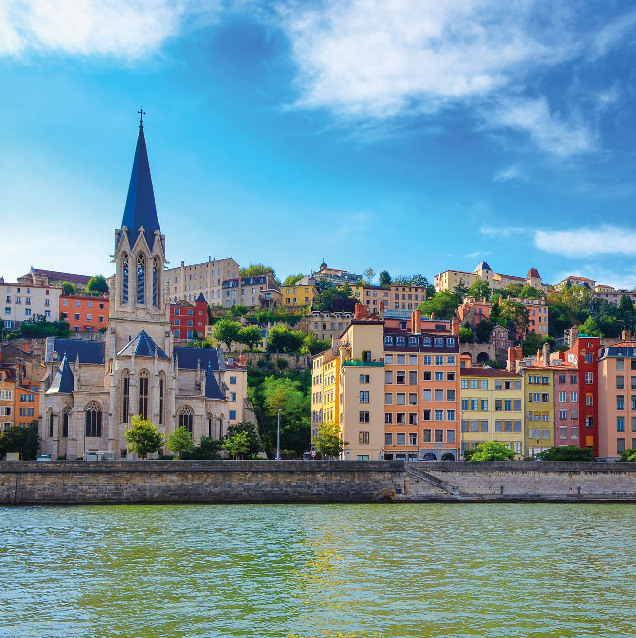 Lyon cityscape from Saone river with colorful houses and river, France