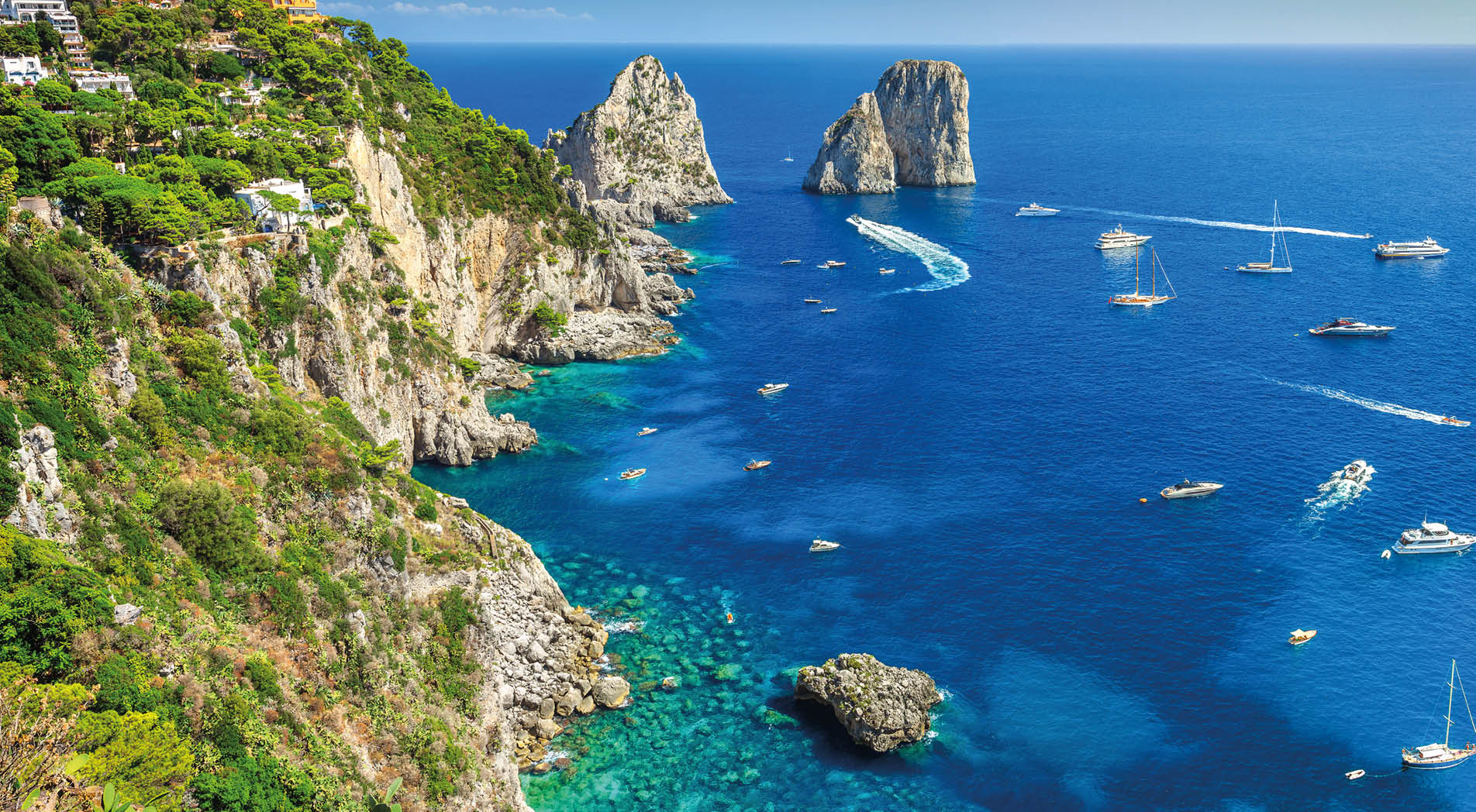 Amazing Faraglioni cliffs panorama with the majestic Tyrrhenian sea in background, Capri island, Campania region, Italy, Europe