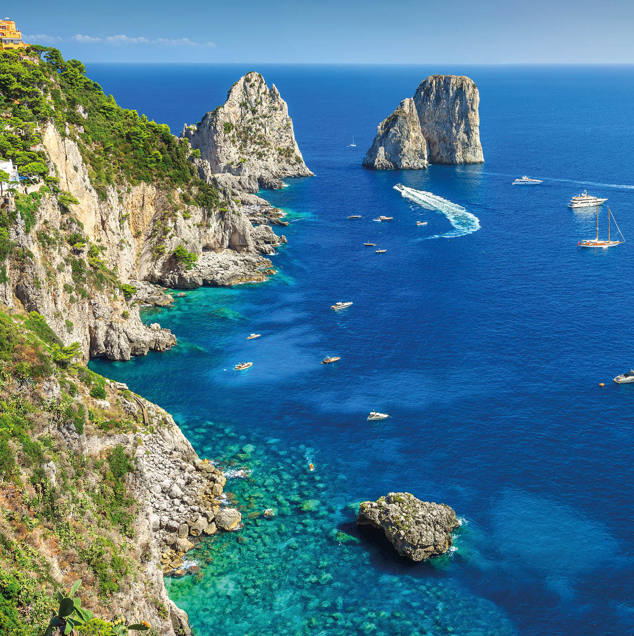 Amazing Faraglioni cliffs panorama with the majestic Tyrrhenian sea in background, Capri island, Campania region, Italy, Europe
