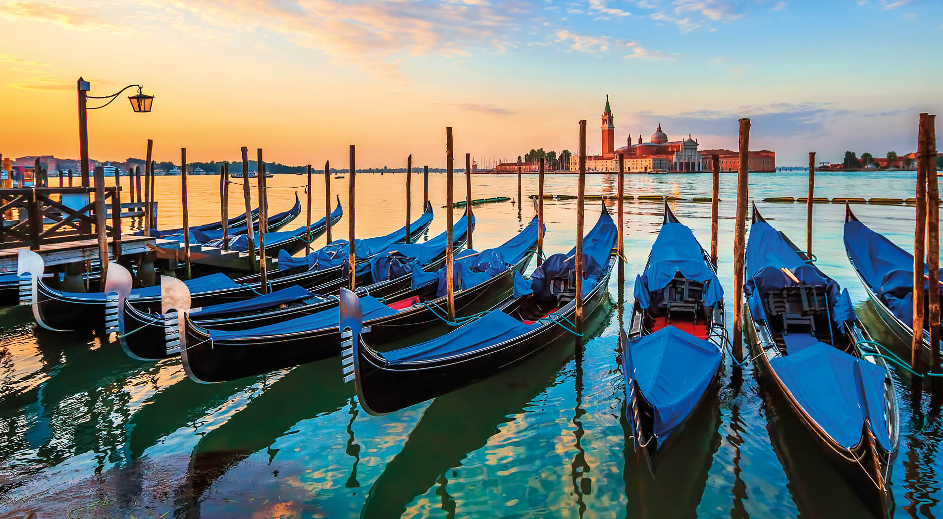 Venice with famous gondolas at sunrise, Italy