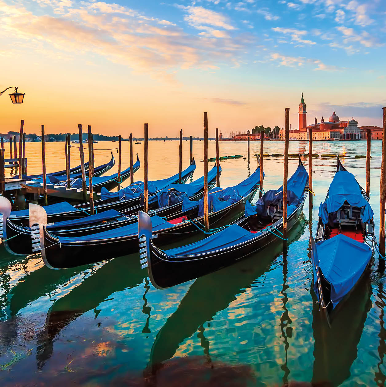 Venice with famous gondolas at sunrise, Italy