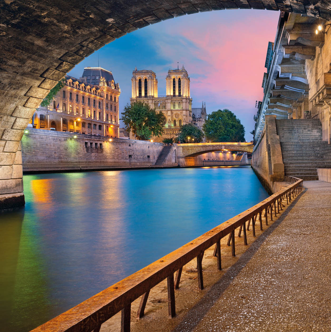 Image of the Notre-Dame de Paris Cathedral and riverside of Seine river in Paris, France.