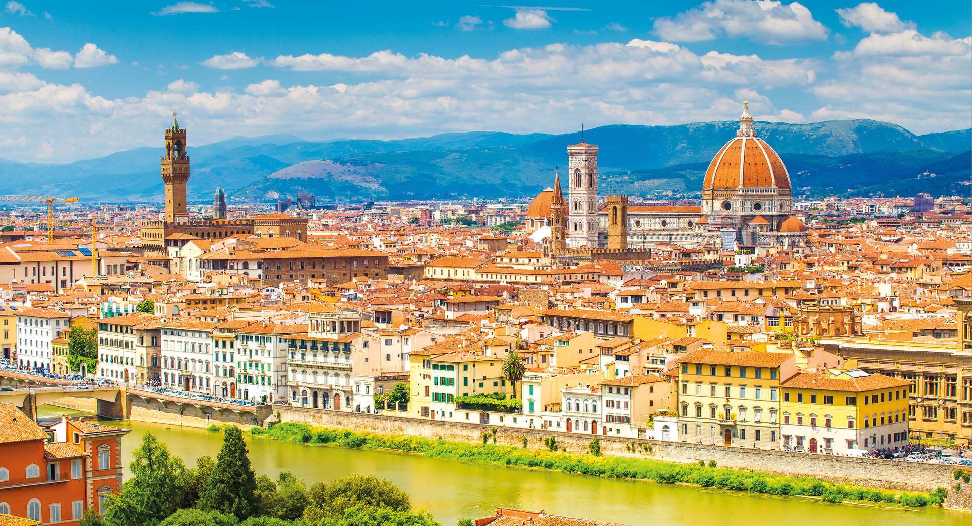 Florence in summer. Stunning Florence cityscape with Arno river and clear blue sky. Historic center of Florence.
