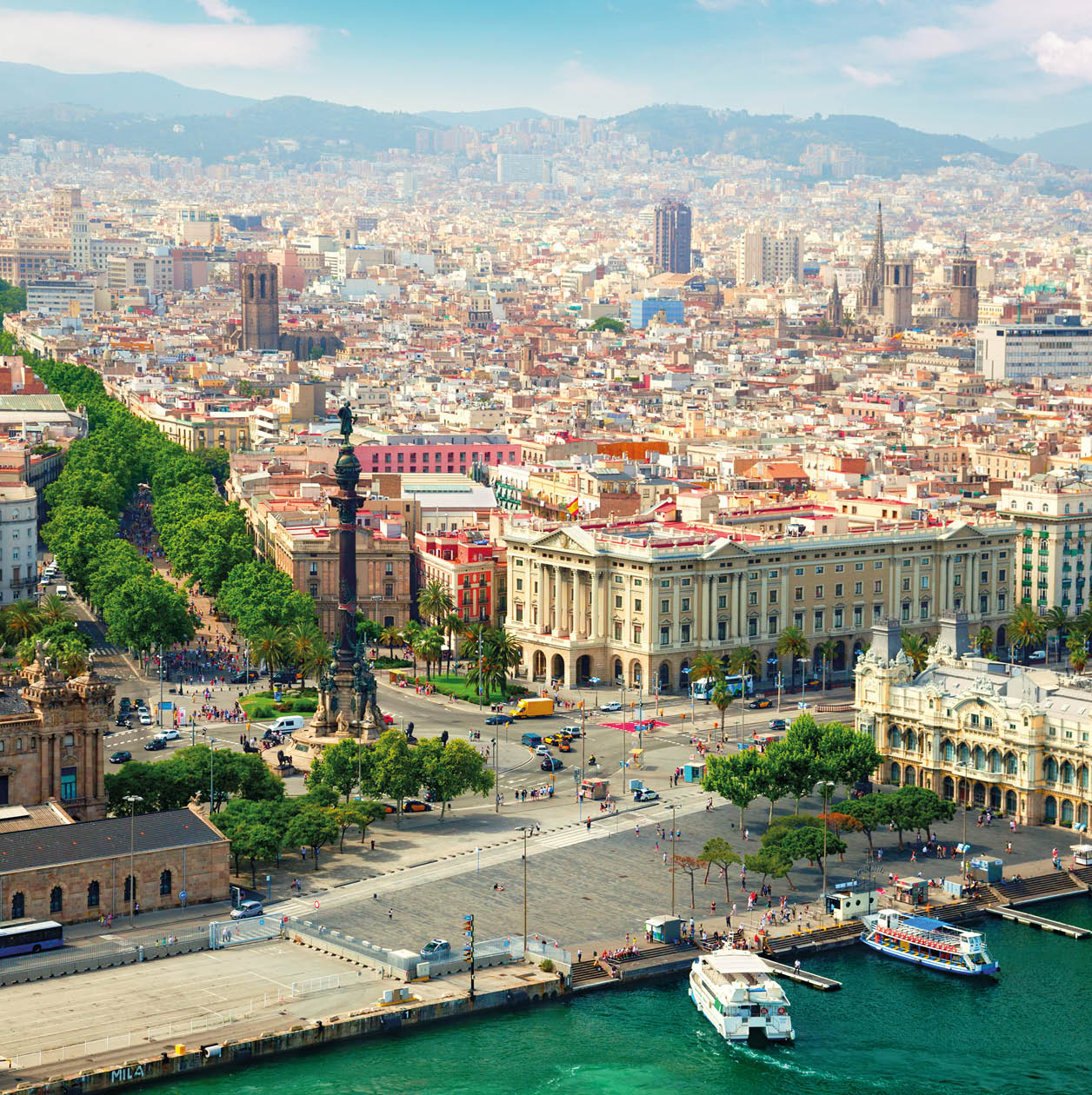 Barcelona city view. Columbus monument and La Rambla on the left