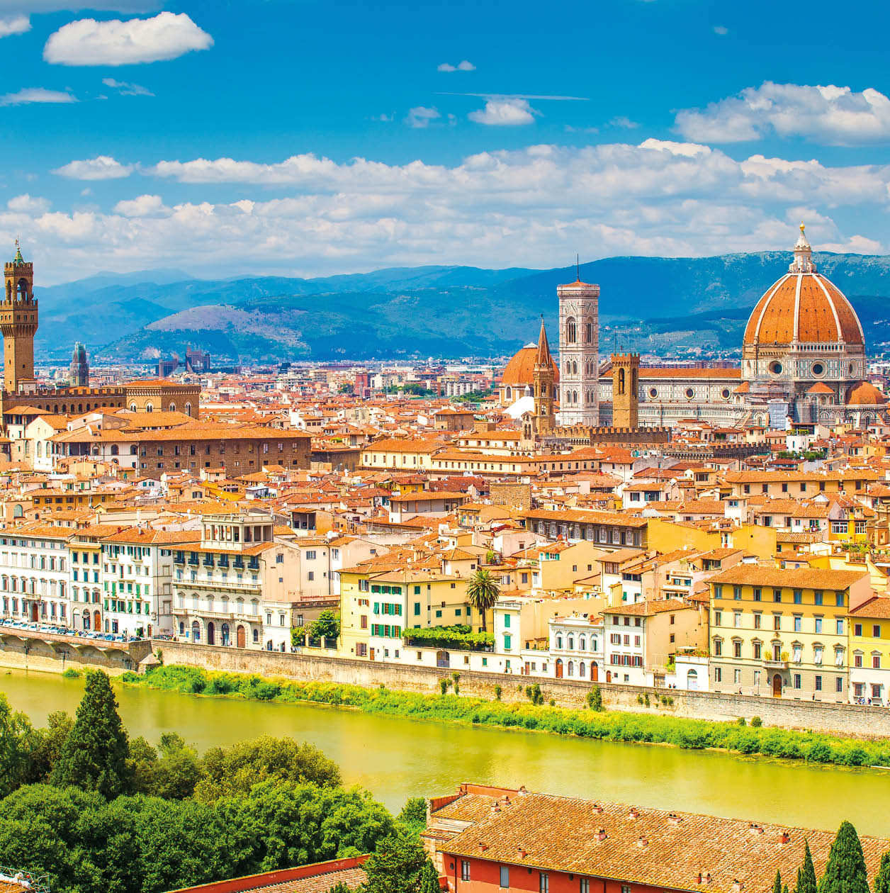 Florence in summer. Stunning Florence cityscape with Arno river and clear blue sky. Historic center of Florence.